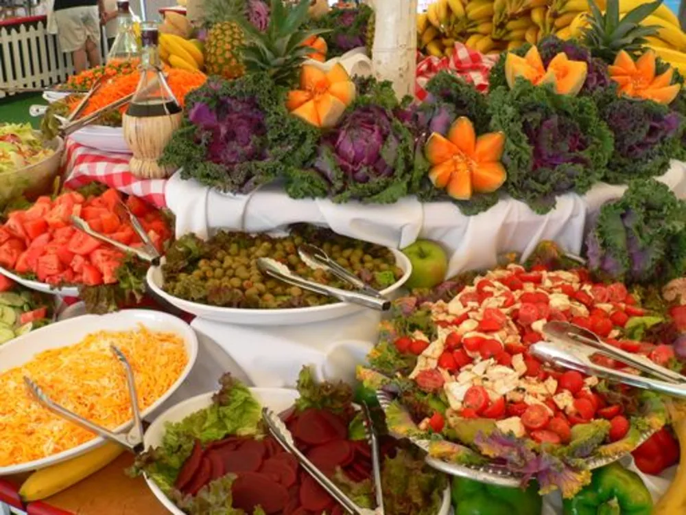 Colorful buffet of fresh salads and fruit