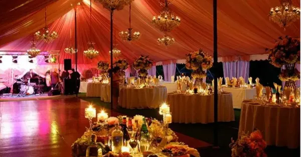 Reception tent set with tables for the wedding party